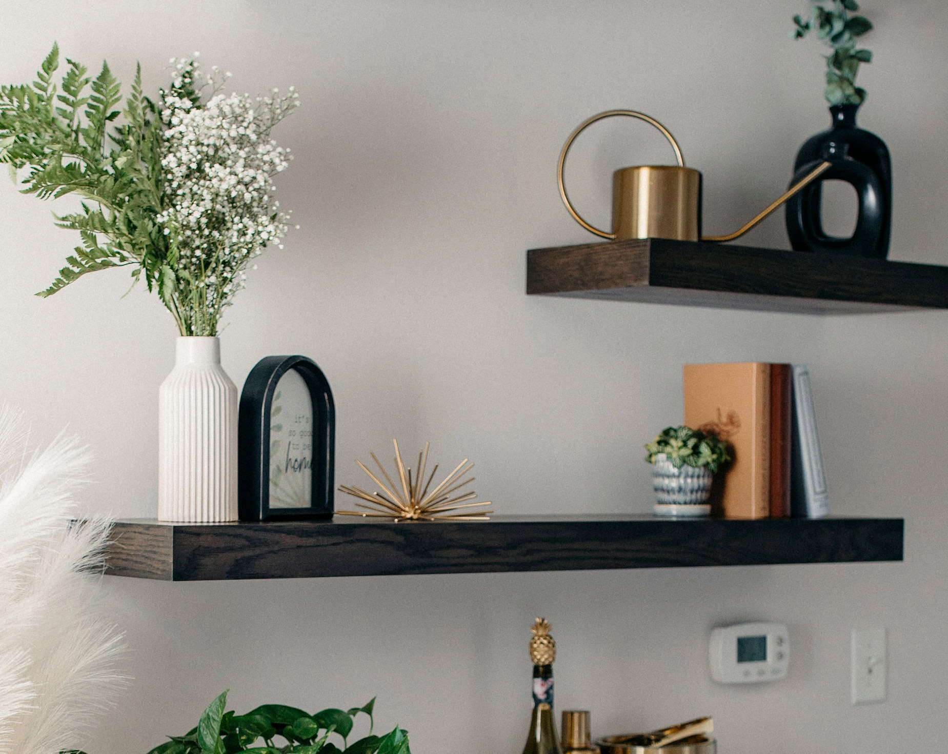 Floating shelves on a wall - blackened mocha finish