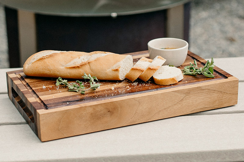 Cutting board with loaf of bread